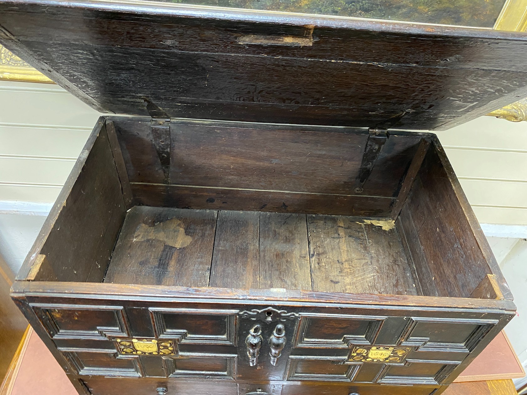 A mid 17th century Continental panelled oak mule chest, with engraved bone inset monograms ‘’R.W’’ and date 1642, width 77cm, depth 47cm, height 48cm